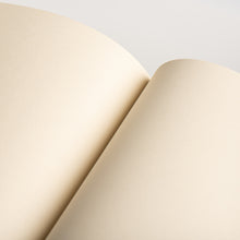 Load image into Gallery viewer, A5 notebook with plain 110gsm recycled pages in a distinctive book white shade
